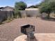 Spacious backyard with desert landscaping, patio, and BBQ grill at 108 E Jasmine St, Mesa, AZ 85201