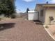This backyard has desert landscaping, brick-paver patio, and storage shed at 108 E Jasmine St, Mesa, AZ 85201