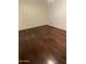 Bedroom features hardwood flooring and window at 108 E Jasmine St, Mesa, AZ 85201
