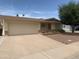 Charming single-story home with desert landscaping, two car garage and front yard at 108 E Jasmine St, Mesa, AZ 85201