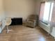 This room has laminate flooring, furniture and AC unit at 108 E Jasmine St, Mesa, AZ 85201