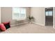 Bright bedroom with natural light, neutral walls and floors and featuring a small desk and plant at 1297 W Chillingham W Rd, San Tan Valley, AZ 85143
