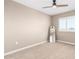 Neutral carpeted bedroom with ceiling fan, standing mirror, and window with white shutters at 1297 W Chillingham W Rd, San Tan Valley, AZ 85143