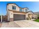 Charming two-story home with large driveway, two car garage, and covered porch at 1297 W Chillingham W Rd, San Tan Valley, AZ 85143