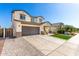 Two-story home featuring a spacious driveway, with charming front porch and side landscaping at 1297 W Chillingham W Rd, San Tan Valley, AZ 85143