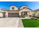 Two-story home with a spacious driveway and a charming covered porch at 1297 W Chillingham W Rd, San Tan Valley, AZ 85143