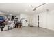 Functional two-car garage with ample space for storage, shelving, and side-door entry at 1297 W Chillingham W Rd, San Tan Valley, AZ 85143