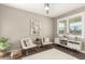 Cozy living room featuring neutral tones and a large window at 1297 W Chillingham W Rd, San Tan Valley, AZ 85143