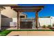 Charming outdoor bar area with a pergola, perfect for entertaining guests and enjoying the backyard at 1297 W Chillingham W Rd, San Tan Valley, AZ 85143