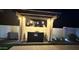 Outdoor bar area with a charming cocktail station and stylish lighting, perfect for entertaining guests at 1297 W Chillingham W Rd, San Tan Valley, AZ 85143