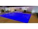 A modern swimming pool featuring ambient lighting for evening swims in a serene backyard at 1297 W Chillingham W Rd, San Tan Valley, AZ 85143