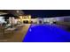 A backyard pool area featuring modern outdoor furniture and ambiance for nighttime relaxation at 1297 W Chillingham W Rd, San Tan Valley, AZ 85143