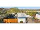 The aerial view shows the home's backyard, fence, covered parking, and desert landscaping at 13013 N 18Th St, Phoenix, AZ 85022