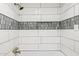 Detail of updated bathroom featuring new shower faucet, new tile, and shower niche at 13013 N 18Th St, Phoenix, AZ 85022