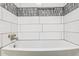 Detail of updated bathroom featuring new shower faucet, new tile and niche at 13013 N 18Th St, Phoenix, AZ 85022