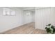 Bright bedroom with mirrored closet doors, luxury vinyl floors, and a window with blinds at 13013 N 18Th St, Phoenix, AZ 85022