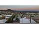 Expansive city view showcases the bustling cityscape and distant mountain range from the home's vantage point at 13013 N 18Th St, Phoenix, AZ 85022