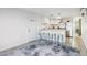 Modern kitchen featuring white cabinets, stainless steel appliances, and a breakfast bar with seating at 13013 N 18Th St, Phoenix, AZ 85022
