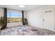 Modern living room featuring a scenic view, plant accents, stylish rug and light walls at 13013 N 18Th St, Phoenix, AZ 85022