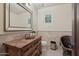 Bathroom with tiled wainscoting, a copper sink and a decorative vanity at 1330 N 40Th St # 1, Mesa, AZ 85205