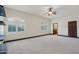 Carpeted bedroom with neutral walls, windows, trim and ceiling fan at 1330 N 40Th St # 1, Mesa, AZ 85205