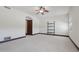 Bright bedroom with a ceiling fan, carpet, wooden trim and decorative shelving at 1330 N 40Th St # 1, Mesa, AZ 85205