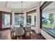 Cozy breakfast nook with large windows overlooking the pool and lush landscaping at 1330 N 40Th St # 1, Mesa, AZ 85205