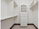 Organized walk-in closet featuring built-in shelves and drawers for ample storage at 1330 N 40Th St # 1, Mesa, AZ 85205