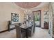 Elegant dining room featuring a brick dome ceiling, chandelier, and access to the outdoor space at 1330 N 40Th St # 1, Mesa, AZ 85205