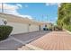Paver driveway leading to a three car garage and gated courtyard entrance at 1330 N 40Th St # 1, Mesa, AZ 85205