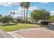 Lush lawn with mature trees and landscaping, including a brick driveway that leads to the house at 1330 N 40Th St # 1, Mesa, AZ 85205