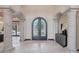 Spacious foyer featuring stone columns and decorative arched doorways at 1330 N 40Th St # 1, Mesa, AZ 85205