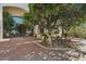 Paved walkway to front entrance with mature landscaping and a charming statue of children on a bench at 1330 N 40Th St # 1, Mesa, AZ 85205