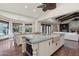 Bright, airy kitchen with an island breakfast bar, and views to both the pool and living spaces at 1330 N 40Th St # 1, Mesa, AZ 85205