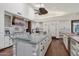 Spacious kitchen featuring custom cabinets, a large center island, and high-end appliances at 1330 N 40Th St # 1, Mesa, AZ 85205
