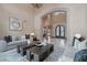 Open-concept living space with tall ceilings, stone archways, and comfortable seating at 1330 N 40Th St # 1, Mesa, AZ 85205