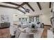 Bright, open living space featuring wood floors, exposed beams and a partial view of kitchen at 1330 N 40Th St # 1, Mesa, AZ 85205