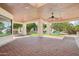 Covered patio with brick pavers, ceiling fan, and views of the pool and waterfall feature in the landscaped backyard at 1330 N 40Th St # 1, Mesa, AZ 85205