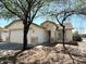 Charming single-story home with a two-car garage and desert landscaping at 1354 S 228Th Dr, Buckeye, AZ 85326