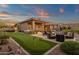 Expansive backyard with putting green, outdoor seating, and BBQ area, ideal for entertaining at 14708 E Canyoncrest Ct, Fountain Hills, AZ 85268