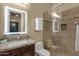 Well-lit bathroom features a granite vanity, glass shower, and decorative wall-mounted towel rack at 14708 E Canyoncrest Ct, Fountain Hills, AZ 85268
