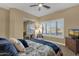 Bright bedroom features a ceiling fan, window shutters, and mirrored closet doors at 14708 E Canyoncrest Ct, Fountain Hills, AZ 85268