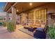 Relaxing covered patio with comfortable seating, ceiling fan, and views of the pool at 14708 E Canyoncrest Ct, Fountain Hills, AZ 85268