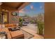 Spacious covered patio with outdoor seating and a view of the landscaped backyard at 14708 E Canyoncrest Ct, Fountain Hills, AZ 85268