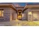 Inviting front entryway with desert landscaping, a secure gate and a conveniently located two car garage at 14708 E Canyoncrest Ct, Fountain Hills, AZ 85268