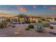 Charming home exterior featuring well-maintained landscaping, desert plants and a three car garage at 14708 E Canyoncrest Ct, Fountain Hills, AZ 85268