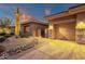 Stunning home exterior with drought resistant landscaping and a convenient two car garage at 14708 E Canyoncrest Ct, Fountain Hills, AZ 85268