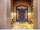 Beautiful wrought iron front door with welcome mat and decor at 14708 E Canyoncrest Ct, Fountain Hills, AZ 85268