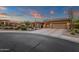 Beautiful single story home at dusk with desert landscaping, warm lighting, and an inviting driveway at 14708 E Canyoncrest Ct, Fountain Hills, AZ 85268
