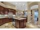 Spacious kitchen featuring stainless steel appliances, custom cabinetry, and a center island at 14708 E Canyoncrest Ct, Fountain Hills, AZ 85268